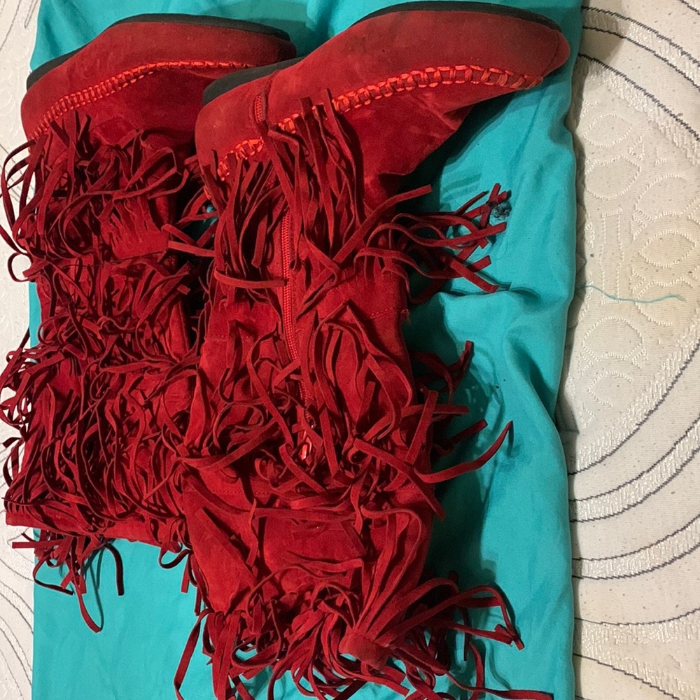 Red calf length moccasins size 6m.